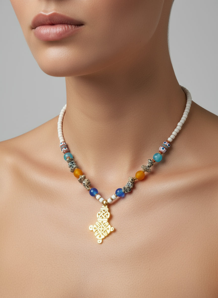 Necklace with colorful beads and a gold pendant on a mannequin